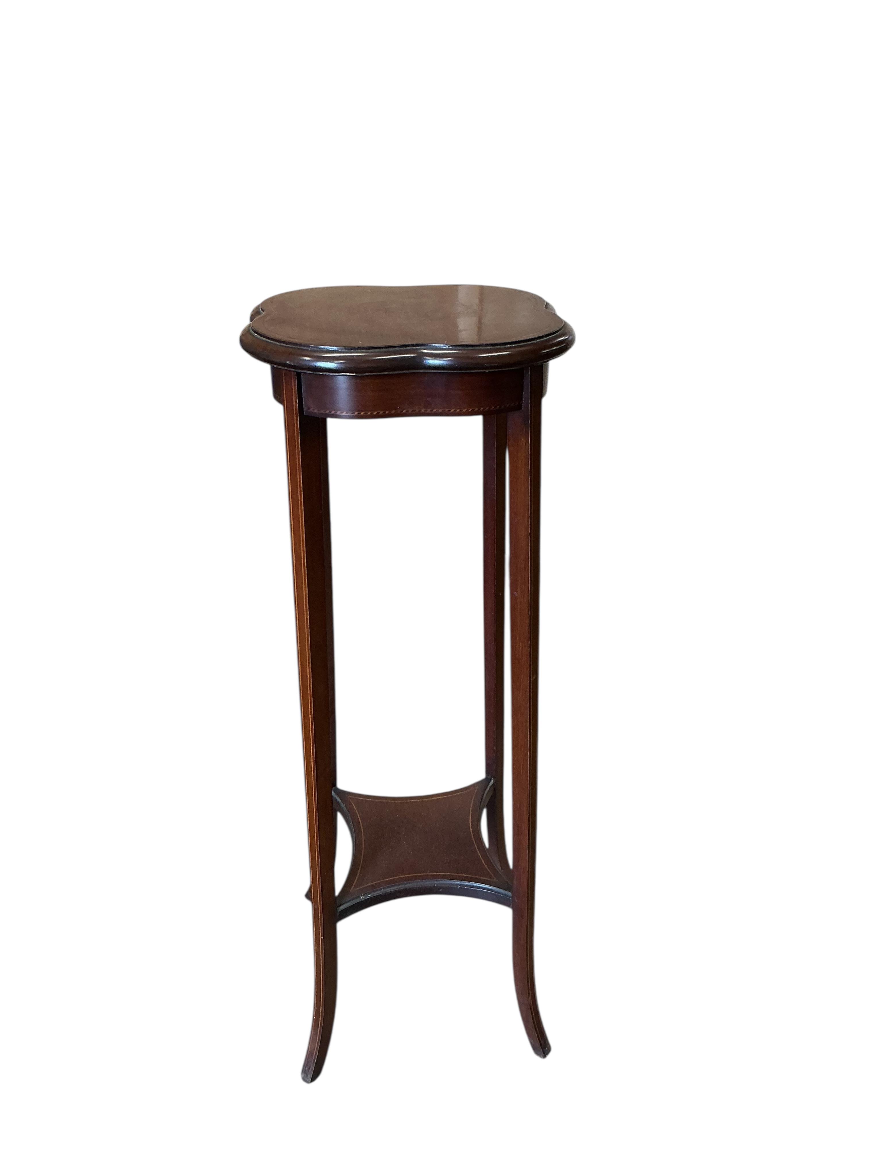 A George III mahogany bow front corner washstand, pot cupboard and an Edwardian plant stand
